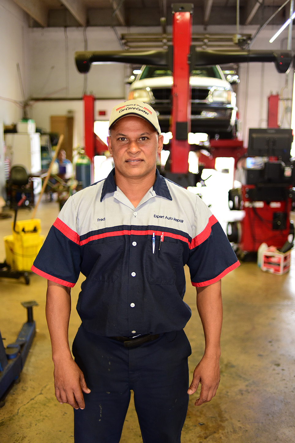 An auto mechanic standing